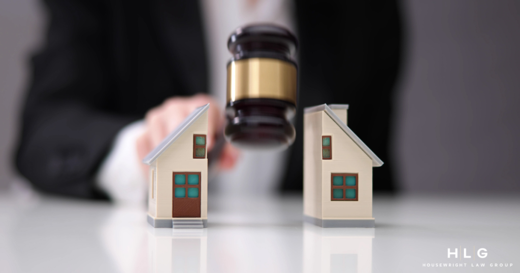 Asset division gavel over house models representing Texas divorce litigation.