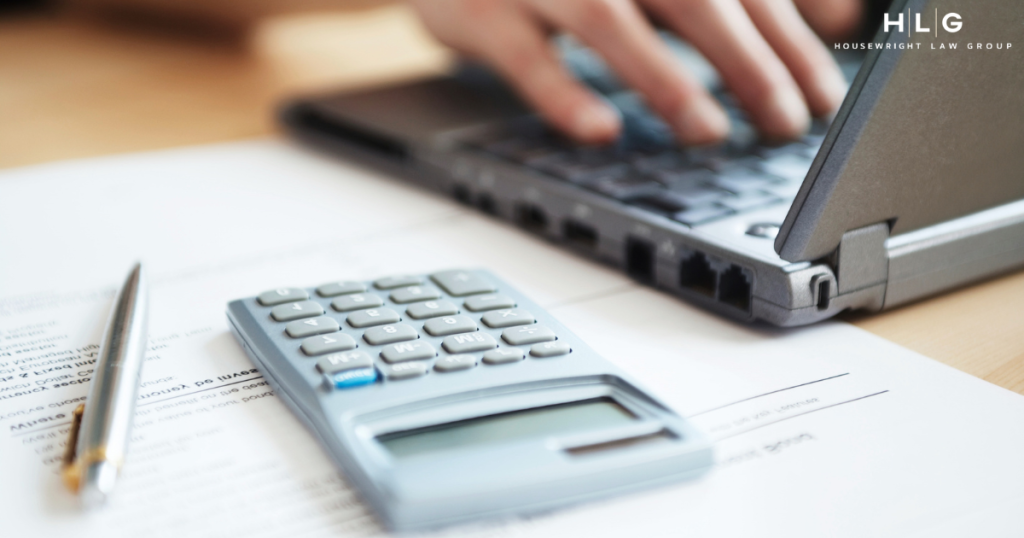 Tax implications of divorce and property division in Texas, calculator and legal documents.